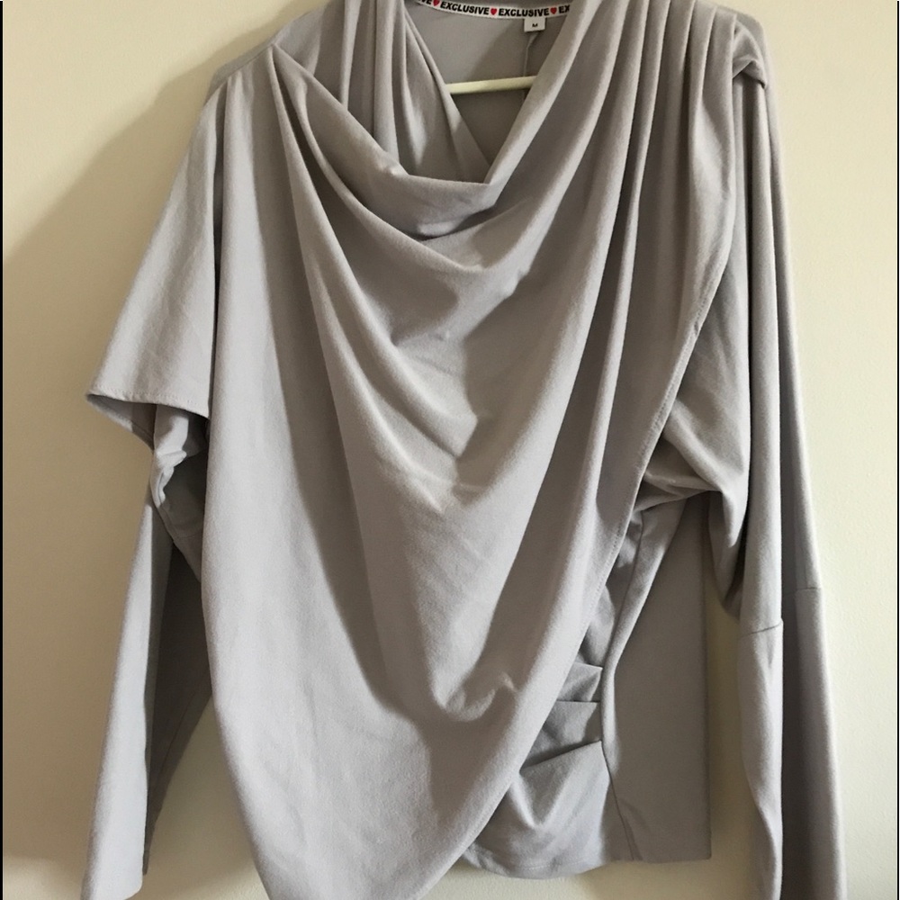 Light grey knit top.  Long sleeves with Drape front.